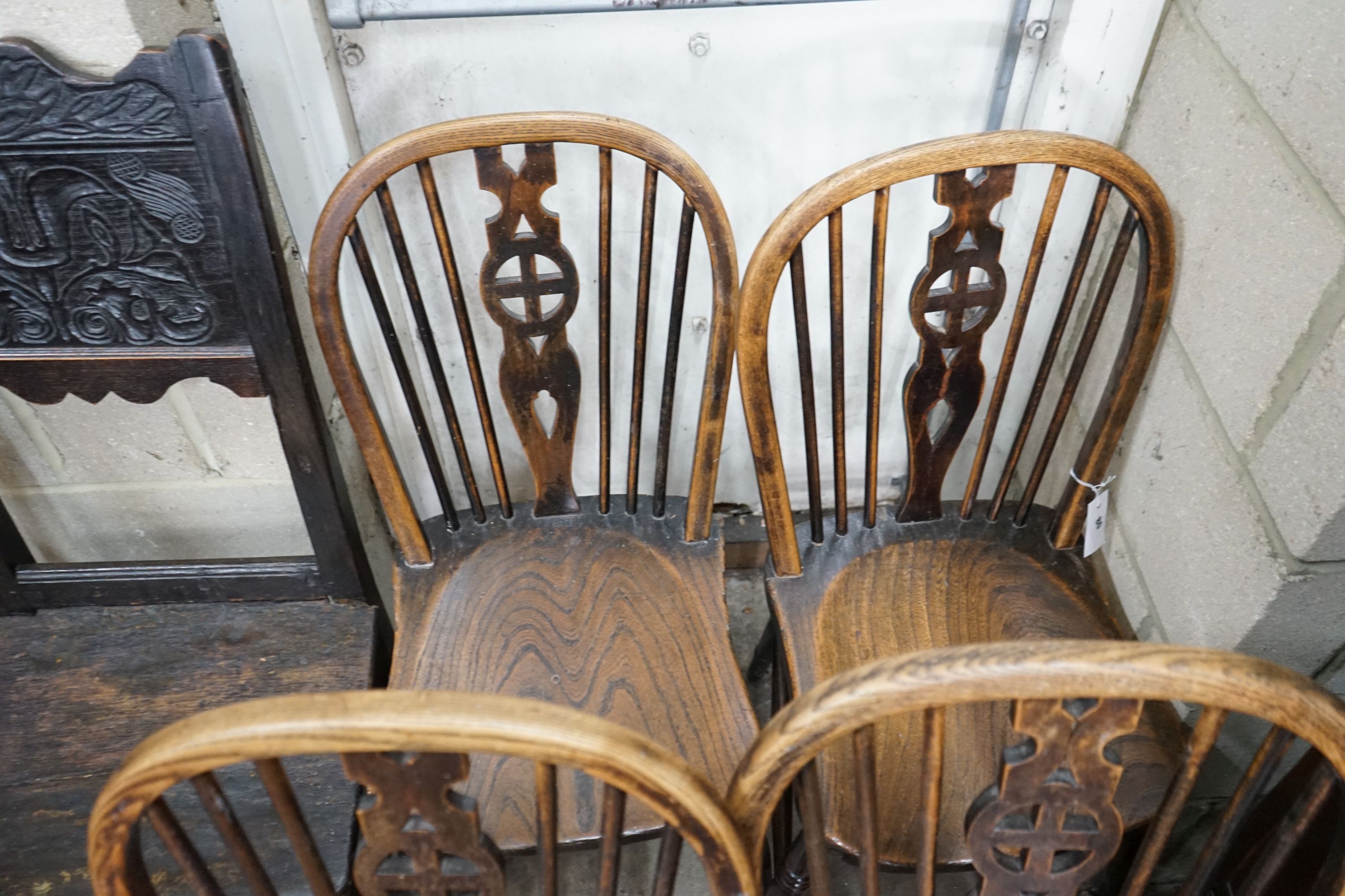 A set of four Victorian ash and elm Windsor wheelback dining chairs